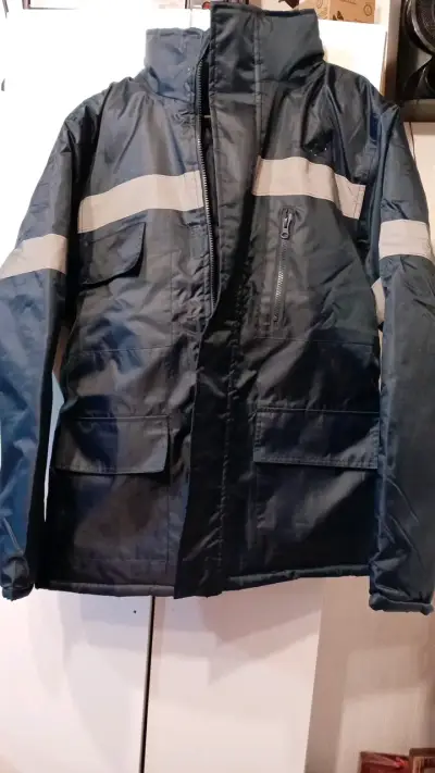 Chaqueta impermeable azul con reflectantes - miniatura 1