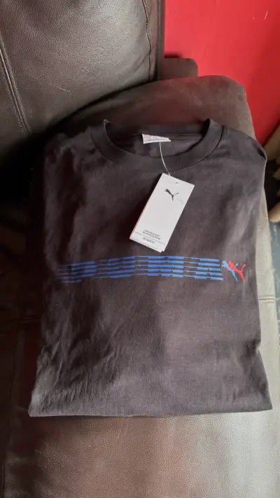 Polera negra Puma con logo azul - miniatura 1