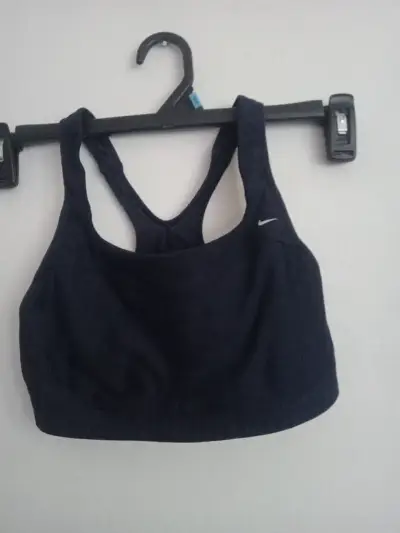 Top deportivo Nike azul marino para mujer - miniatura 1