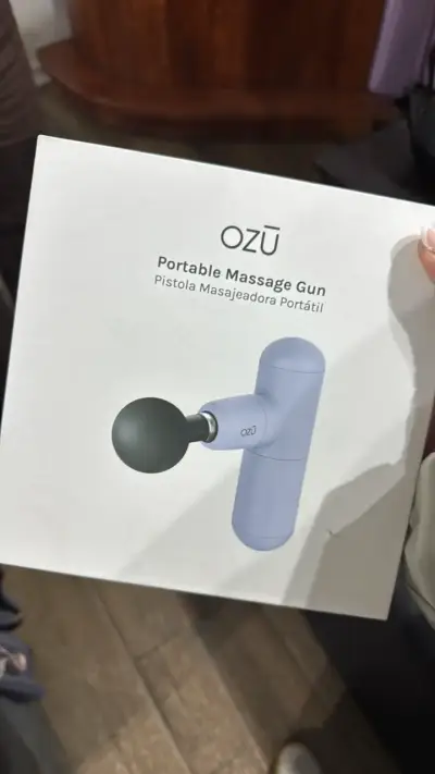 Pistola de masaje portátil OZŪ - miniatura 1