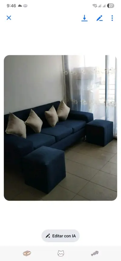 Sofá modular azul con cojines beige - miniatura 1