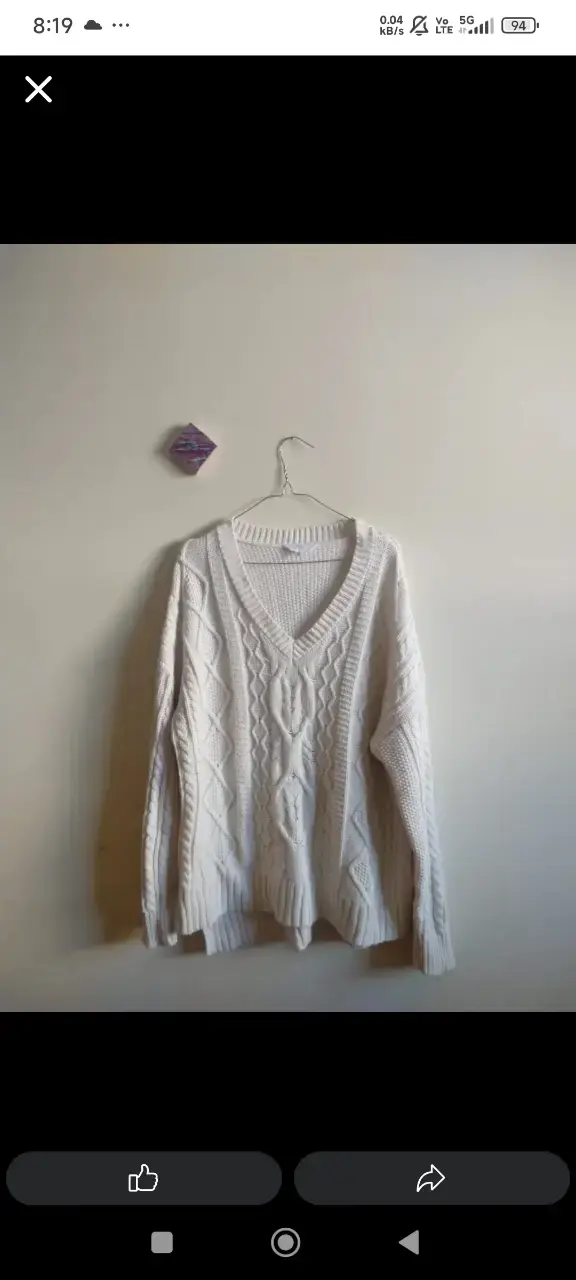 Suéter de lana blanco con diseño trenzado