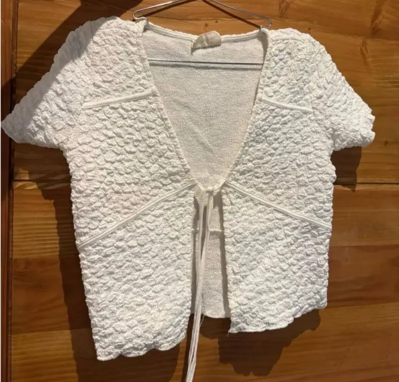 Top blanco de punto con lazo, marca Americanino - 1