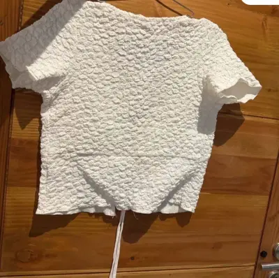 Top blanco de punto con lazo, marca Americanino - miniatura 2
