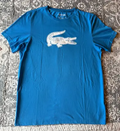 Polera Lacoste Sport azul con logo - miniatura 1