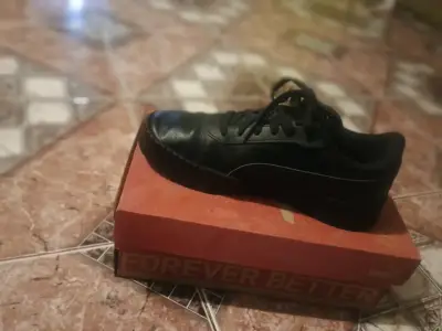 Zapatillas negras Puma casuales - miniatura 1