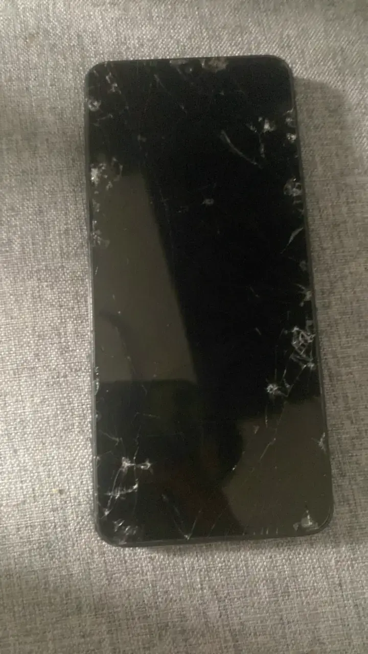 Teléfono móvil con pantalla rota para repuestos - 1