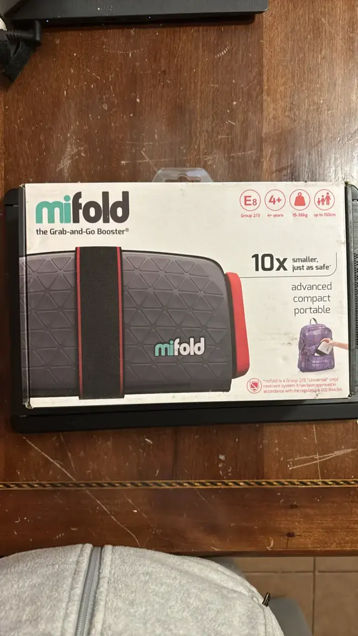 Asiento elevador portátil Mifold compacto - 1