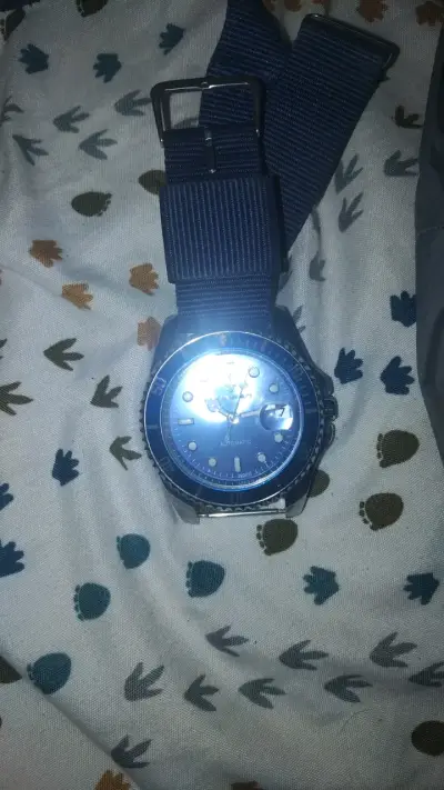 Reloj automático azul con correa de tela - miniatura 1