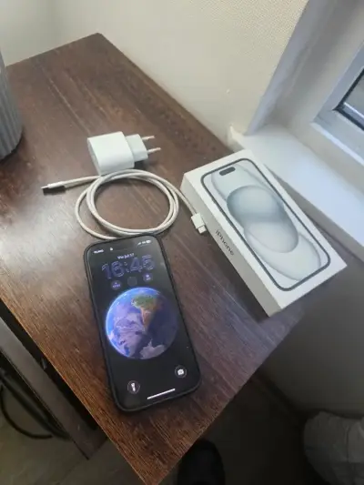 iPhone con cargador y caja original - miniatura 3
