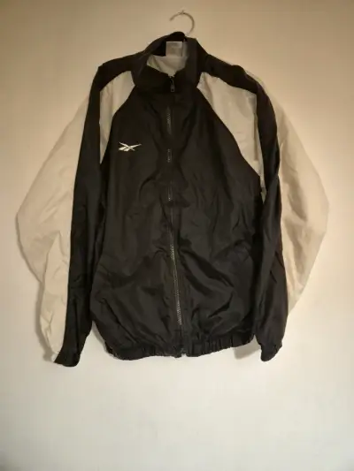 Cortavientos Reebok negro y blanco unisex - miniatura 1