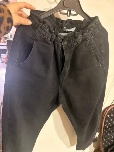 Jeans negros con cintura elástica para mujer - miniatura 1