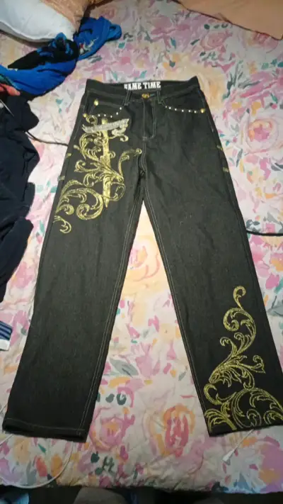 Jeans negros con diseño dorado para hombre - miniatura 1