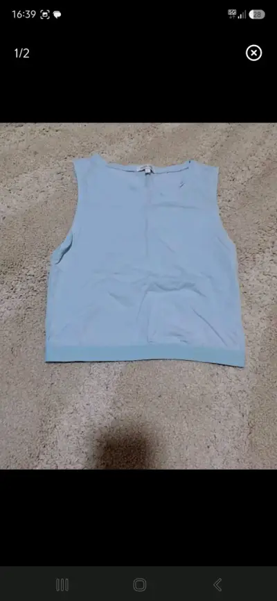 Polera sin mangas azul claro para mujer - miniatura 1