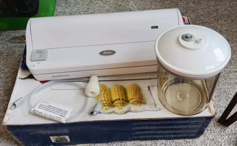 Selladora al vacío Oster FoodSaver con accesorios - 1