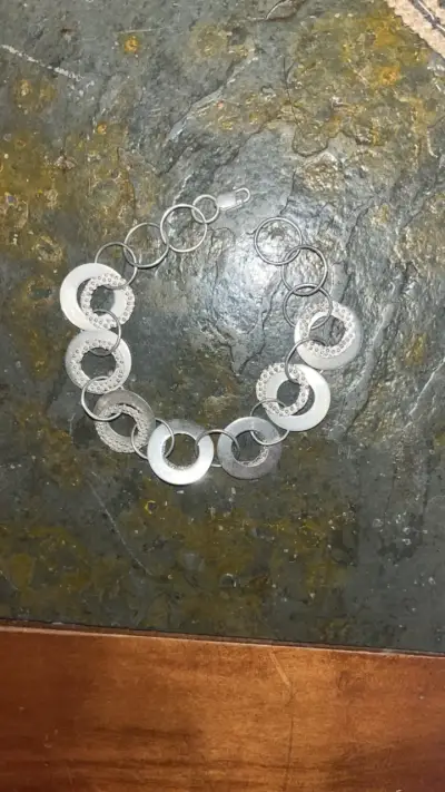 Pulsera de plata con diseño circular - miniatura 1