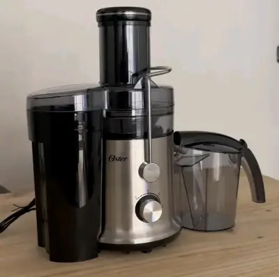 Extractor de jugos Oster de acero inoxidable - miniatura 2