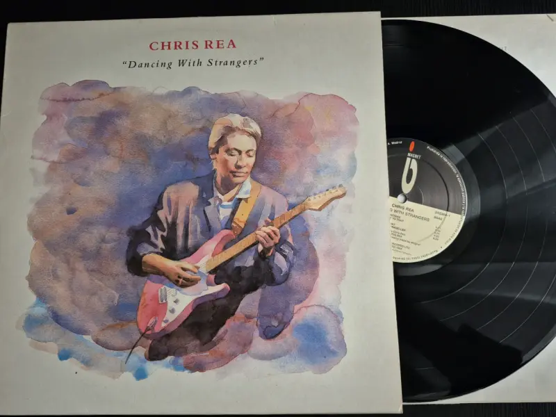 Vinilo Chris Rea 'Dancing With Strangers' en buen estado