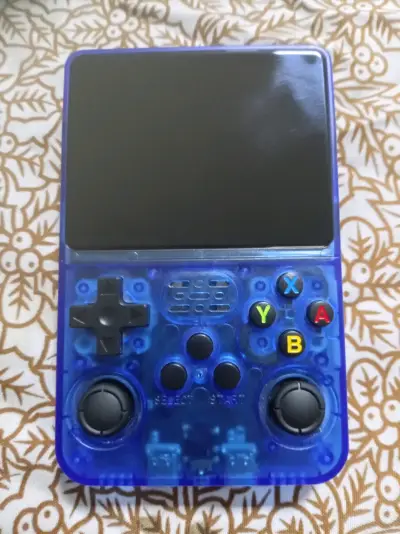 Consola portátil retro azul con juegos integrados - miniatura 1
