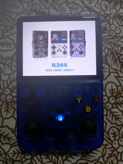 Consola portátil retro azul con juegos integrados - miniatura 3