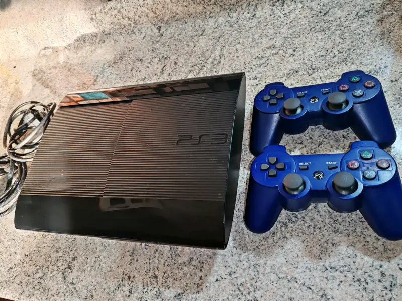 Consola PS3 Con 57 Juegos + Controles y Cables - 1