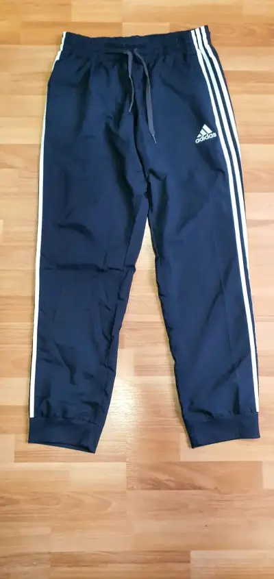 Pantalones deportivos Adidas azul marino con franjas - miniatura 1