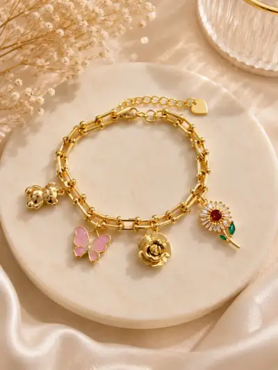 Pulsera lamanidas en oro  18kcon dijes decorativos - miniatura 1