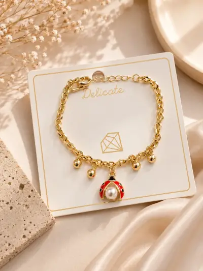 Pulsera lamanidas en oro  18kcon dijes decorativos - miniatura 3