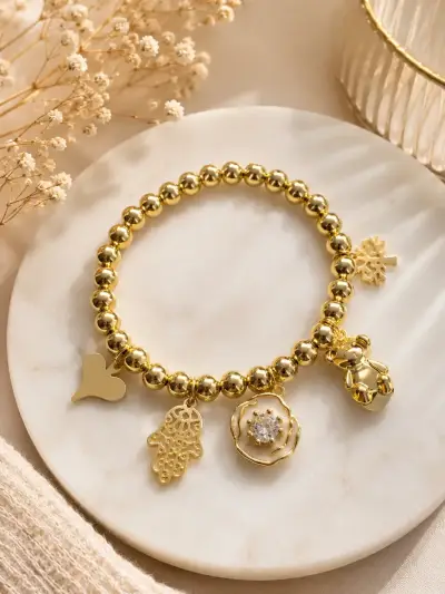 Pulsera lamanidas en oro  18kcon dijes decorativos - miniatura 5