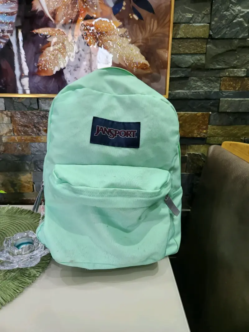 Mochila Jansport verde menta con bolsillo frontal