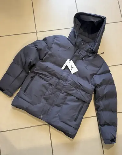 Chaqueta impermeable gris con capucha Jordan - miniatura 1