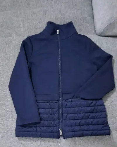 Chaqueta azul para mujer con cierre y diseño acolchado - miniatura 1