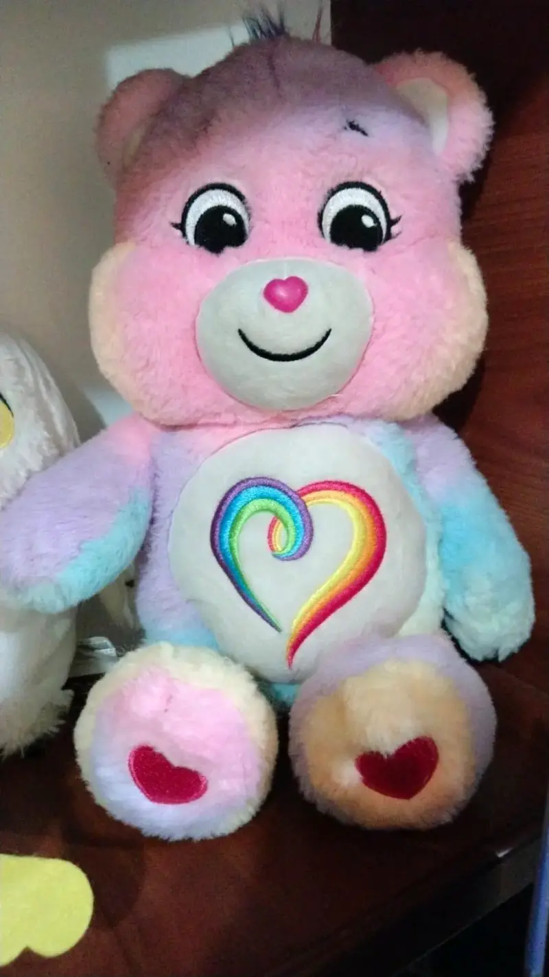 Peluche de oso arcoíris con corazón