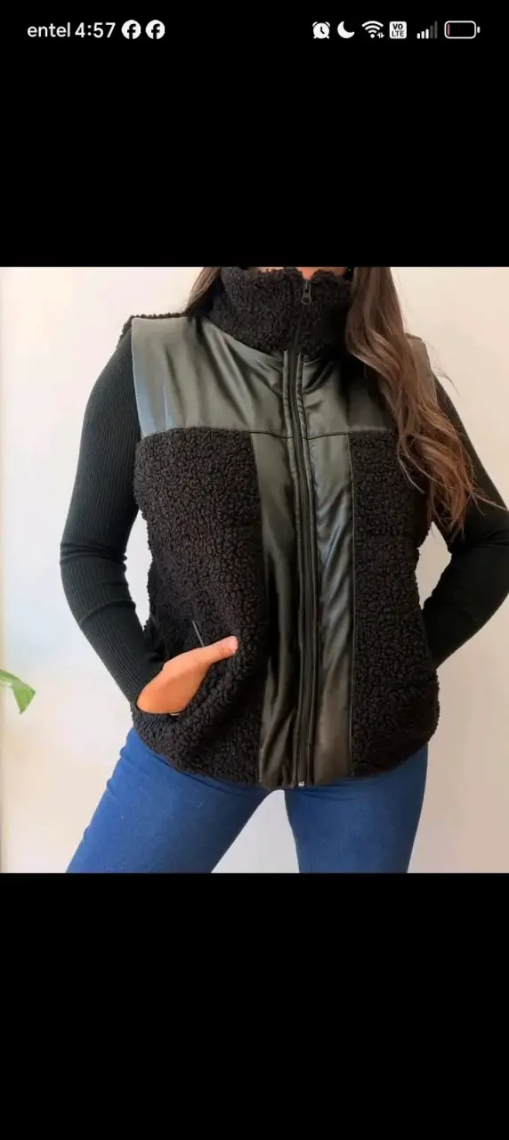 Chaqueta sin manga color negro con cierre frontal