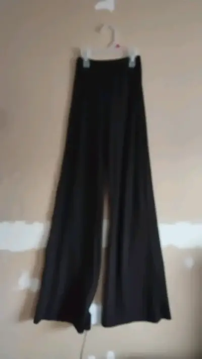 Pantalones palazzo negros elegantes - miniatura 1