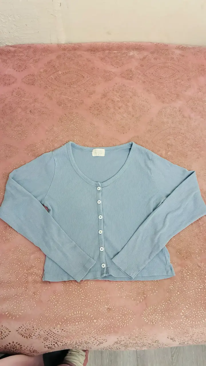 Top azul claro de punto para mujer