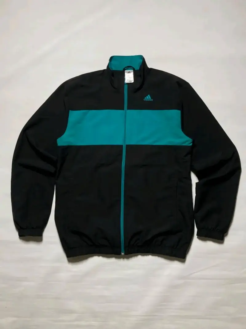 Cortavientos Adidas negro y calipso - 1