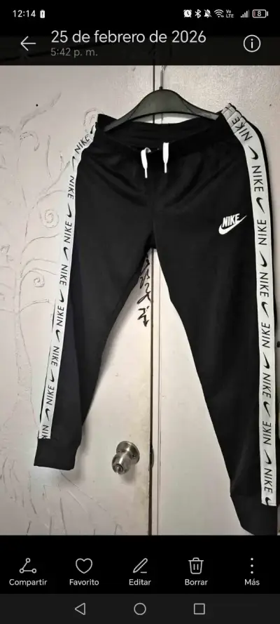 Pantalones deportivos Nike negros con franjas - miniatura 1