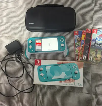 Nintendo Switch Lite turquesa con juegos y accesorios - miniatura 1