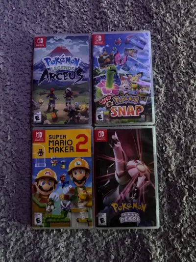 Nintendo Switch Lite turquesa con juegos y accesorios - miniatura 2