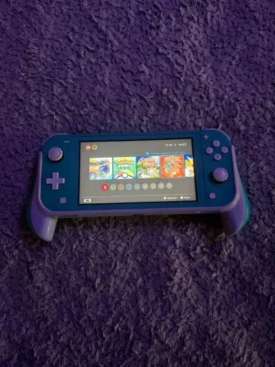 Nintendo Switch Lite turquesa con juegos y accesorios - miniatura 5