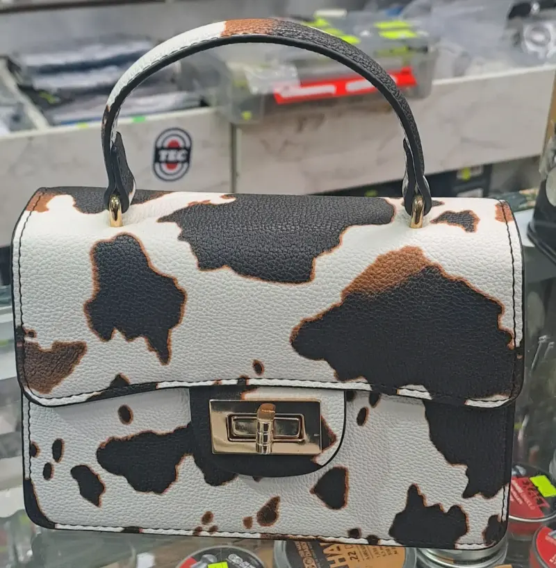 Cartera de mano estampado animal print