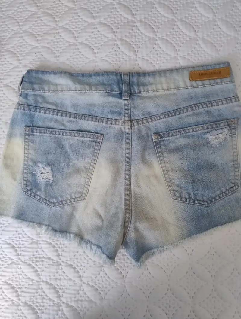 Shorts de mezclilla desgastados para mujer