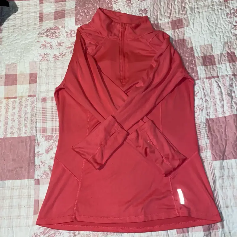 Polera deportiva roja RBX para mujer