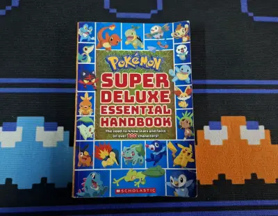 Libro Pokémon Super Deluxe Essential Handbook - miniatura 1