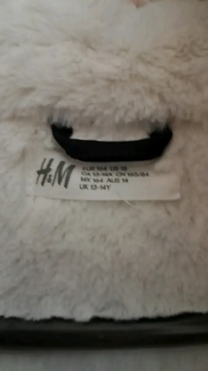 Parka negra con capucha de piel sintética H&M - 2