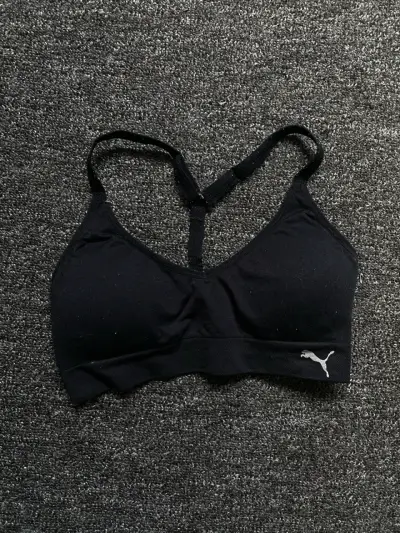 Top deportivo negro Puma para mujer - miniatura 1