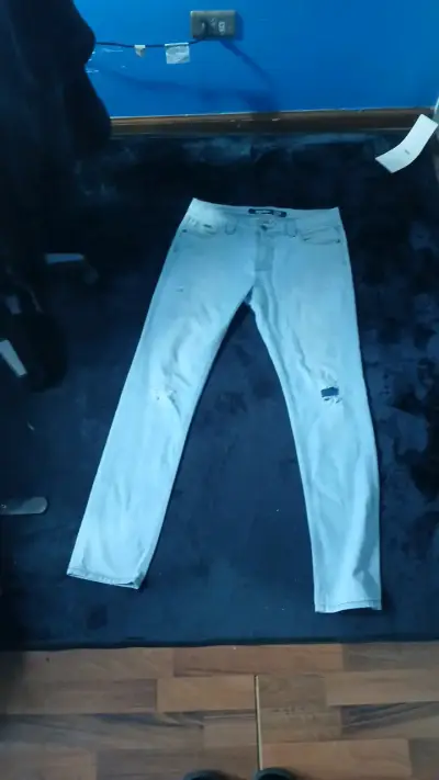 Jeans celestes desgastados para mujer - miniatura 1