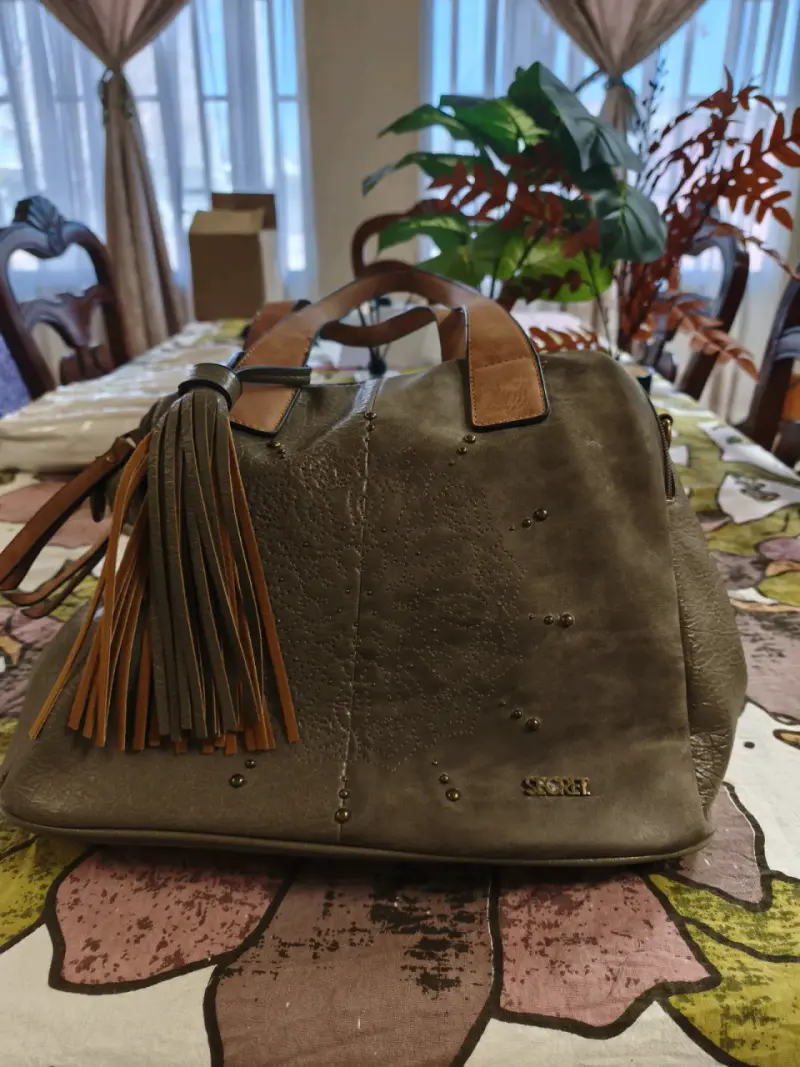 Bolso de cuero marrón con flecos Secret