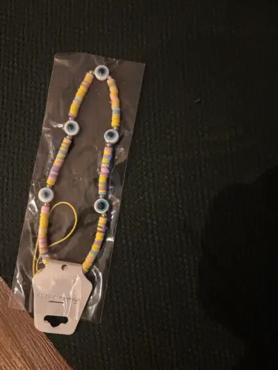 Accesorio para celular con ojo turco multicolor - miniatura 1